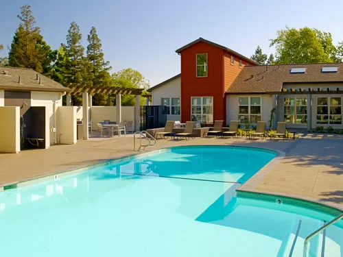 Swimming pool, sundeck with lounge seating - eaves Fremont