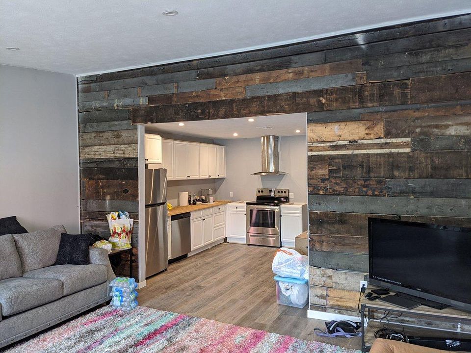 Wood feature wall was constructed with left over planks found after demo.