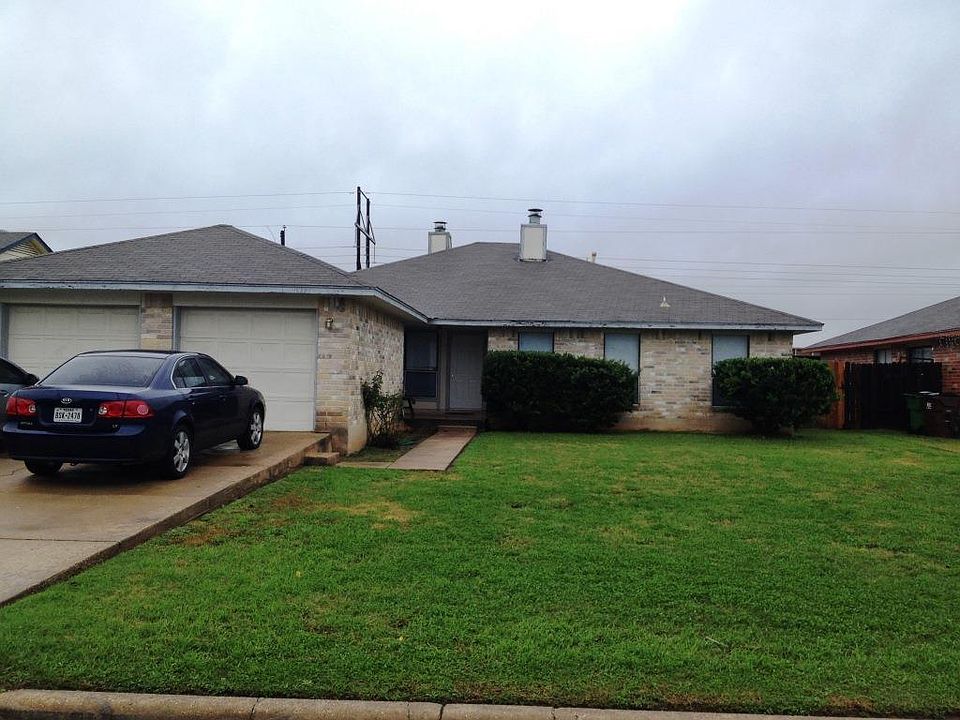 Duplex one car garage on left