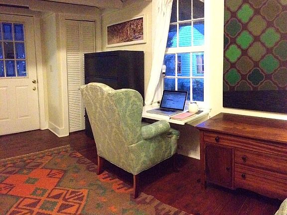 There is a collapsable desk/ workspace under the window that