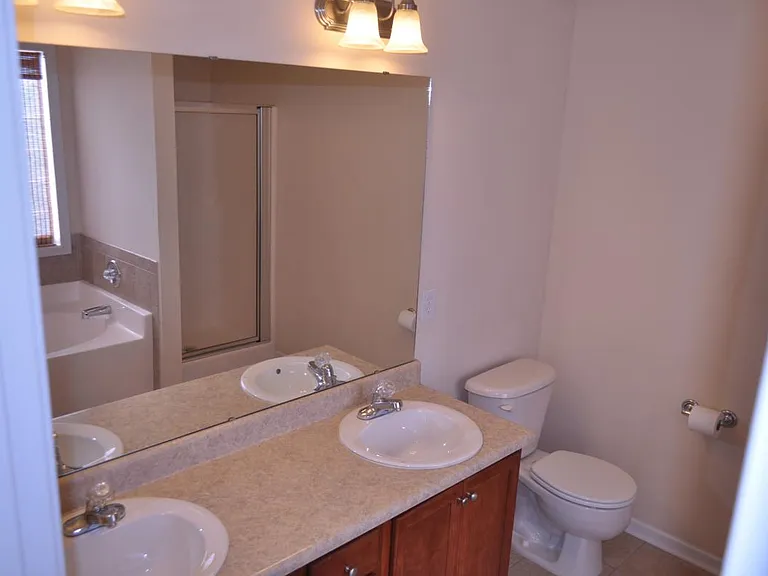 Master Bathroom double sink with private shower and bath tub