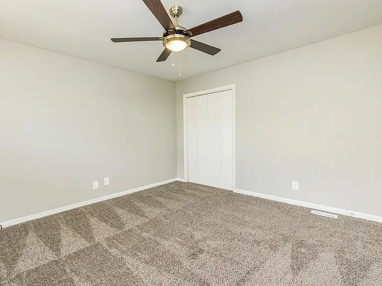 Bedroom with carpet & ceiling fan