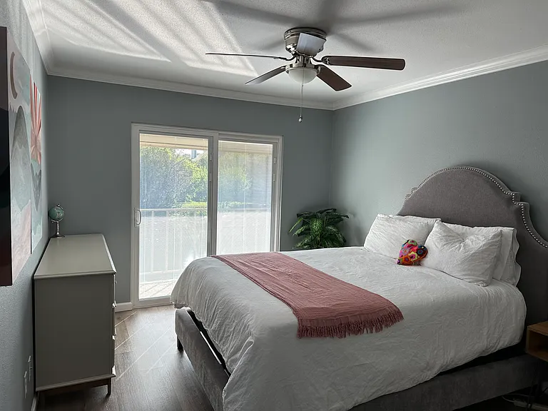 Second bedroom with access to balcony.