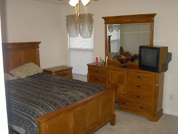 Master Bedroom with wooden furniture (two night tables included),