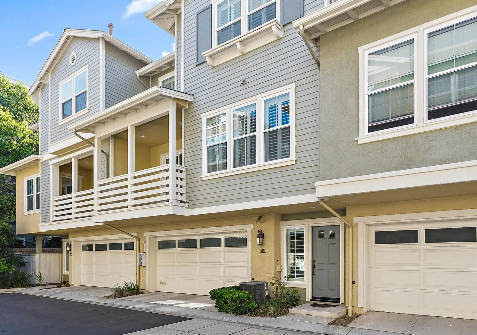 1,330-square-foot townhome offers 2 bedrooms, 2.5 bathrooms, and a 2-car direct-access garage — Photo 1