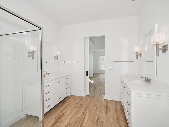 Primary bath with freestanding vanities