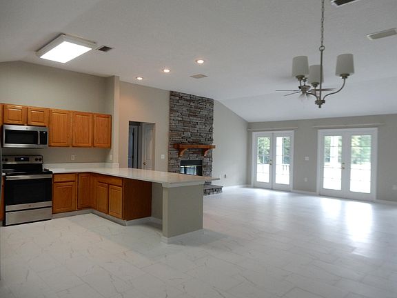 Quartz countertops in Kitchen with stainless steel appliances