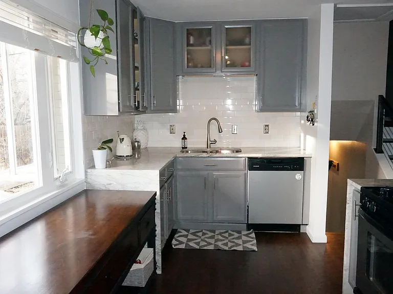 Kitchen and main floor have been opened up for a more modern floorplan.