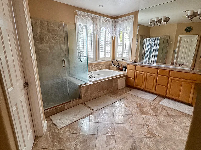 Master Bath room with shower and Jacuzzi tub