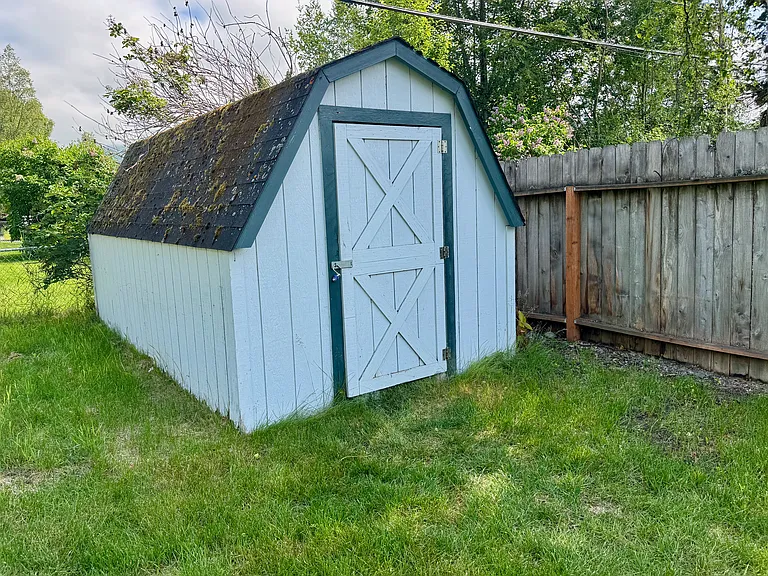 Lockable storage shed in backyard, but not heated.