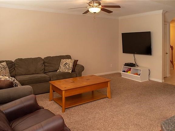 You'll enjoy lounging in the large family room that is open to the kitchen and dining area.