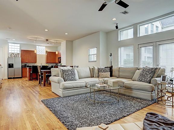 The second floor is an extremely spacious open floor plan with high ceilings, hardwoods & recessed lighting throughout.