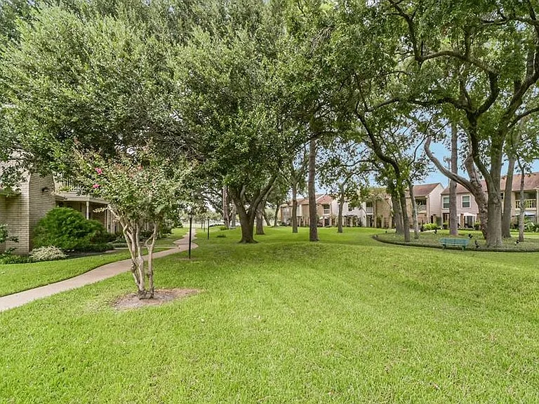 Green walking trail inside the gated community