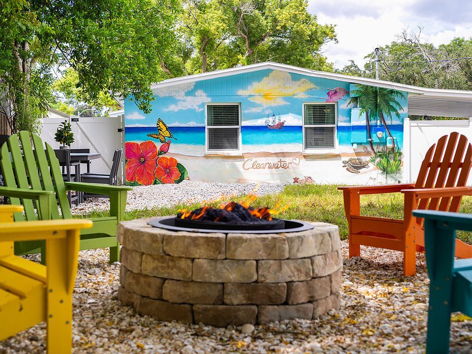 Gather around the firepit with friends and family, and enjoy the vibrant mural.