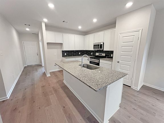 The Waring III- Kitchen Angle. Home under construction. Sample floor plan photo used for illustrati