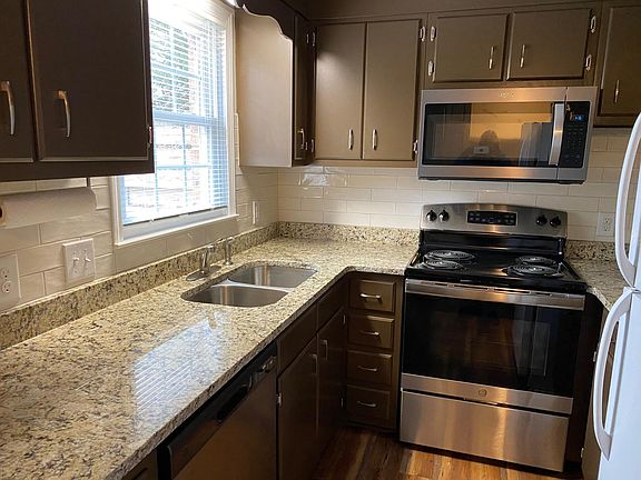 kitchen with granite counter top and stainless steel appliances
