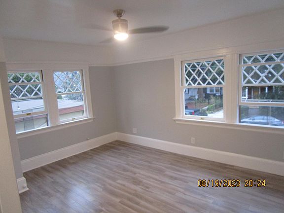 Living Space- Sunny mornings. Notice the trim work and 4 windows in living space.