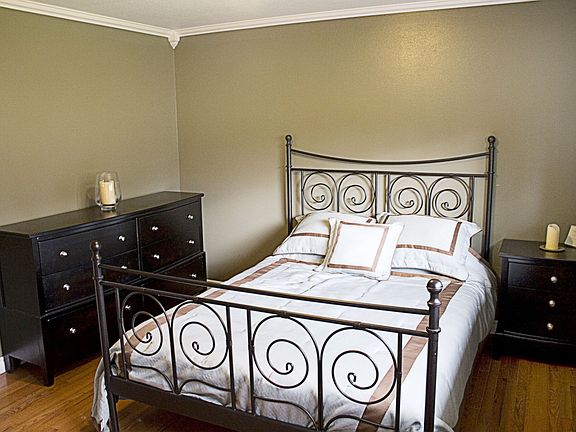 Master with Crown molding and cherry hardwoods