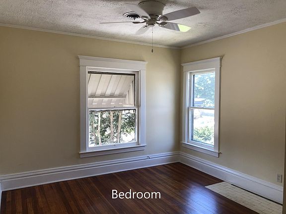 Bedroom - newly refinished hardwood floors - large closet with sliding doors - ceiling fan