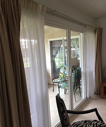 Sliding glass doors opening to patio from living room.