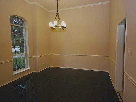 Elegant formal dining with black marble tile.