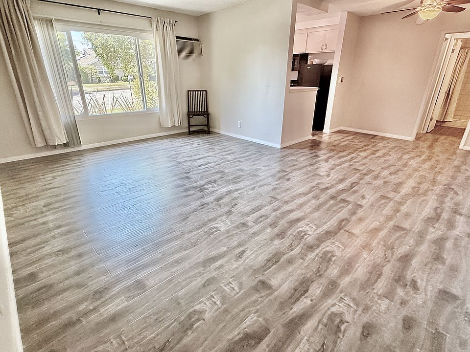 Spacious & bright living room w/open dining room.
