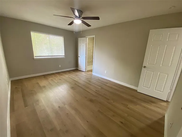 Primary Bedroom showing door to private bath