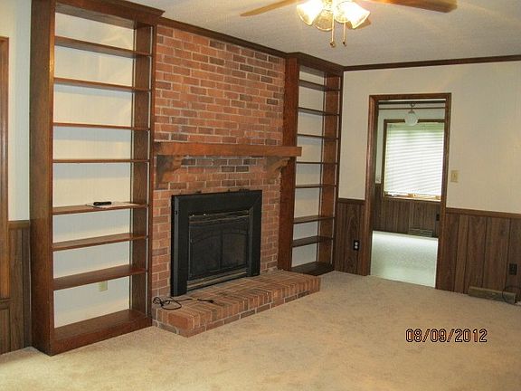 Family room with fireplace and built in bookshelves