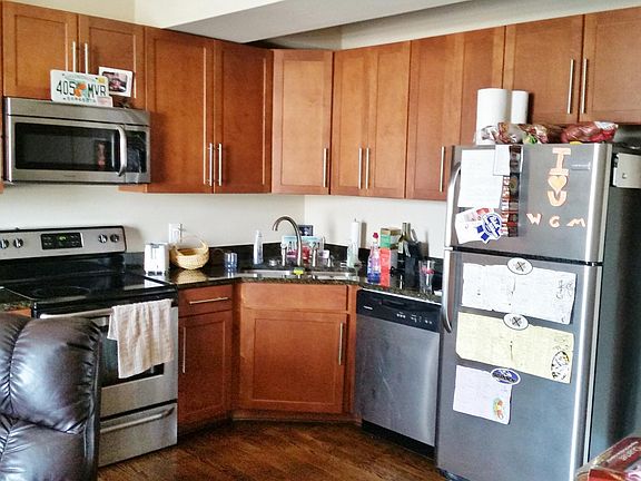 Kitchen w/ wood cabinets, granite c-tops and stainless steel
