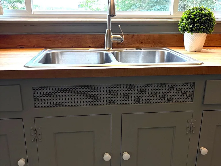 Kitchen sink with large picture window and view to backyard