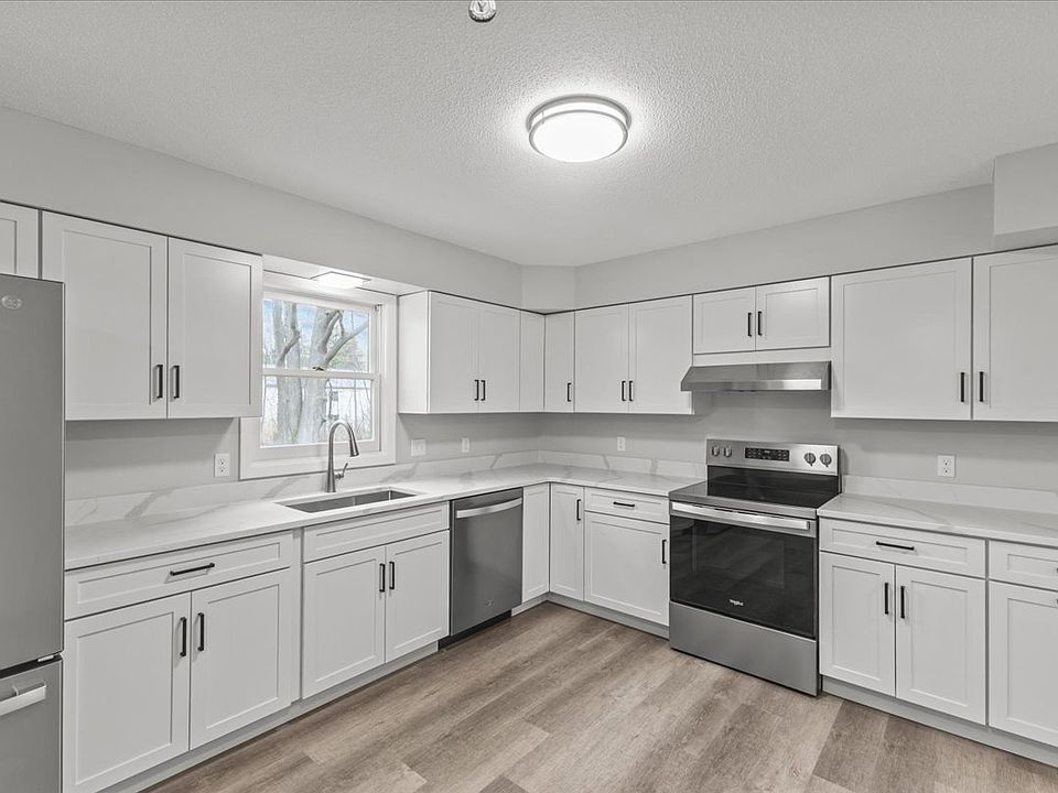Kitchen with brand new counters, appliances, cabinets and flooring