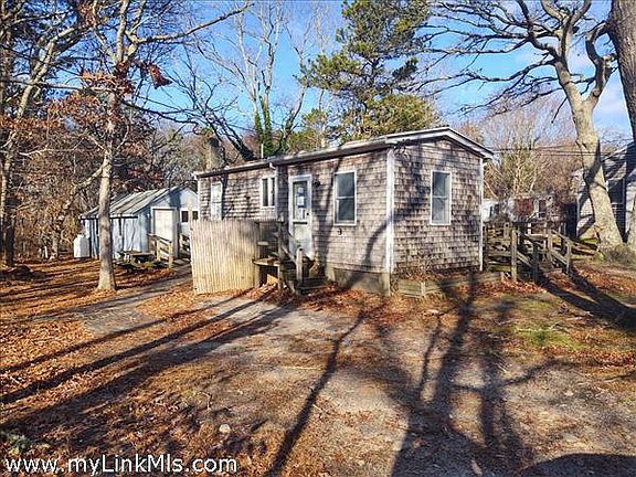 Left side of home with entry into back addition.