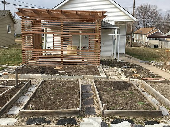 back yard w/pergola and gardens
