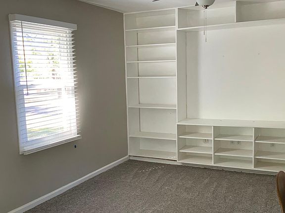 Family/ media room. Full wall built in shelves