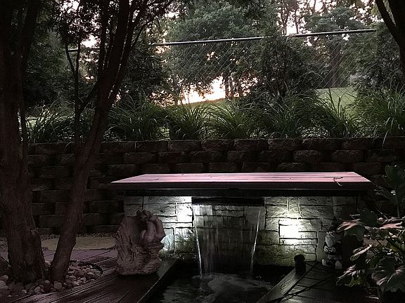 Pond waterfall with lights 