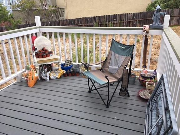 Deck off master bedroom before backyard renovation.