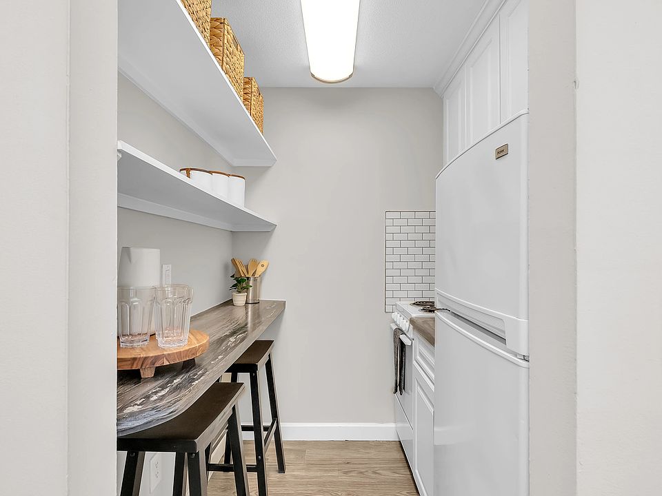 Experience contemporary style in our newly renovated studios with white cabinetry and shelving and granite-inspired countertops.