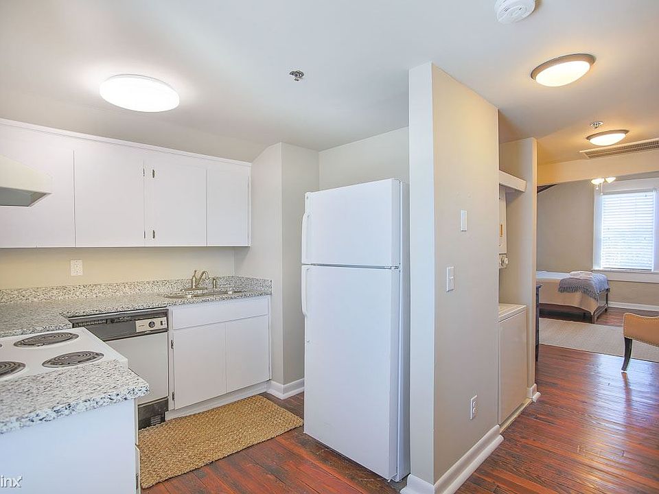 The kitchen is towards the end of the apartment.