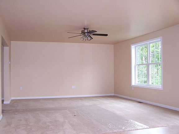Relaxing Family Room with Sliders Leading to Patio