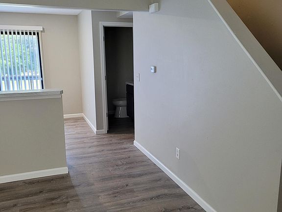 Living Room looking towards kitchen and downstairs bathroom