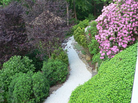 Gravel path runs by gazeb