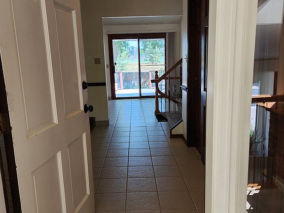 Front hallway with extended redwood floor closet space