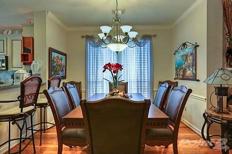 Dining room with large table.