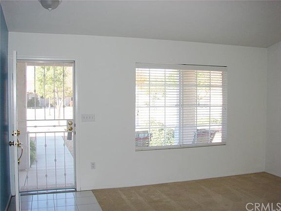 FRONT ENTRY FROM PORCH, TILED ENTRY TO LARGE LIVING ROOM DINING ROOM -GREAT AREA.