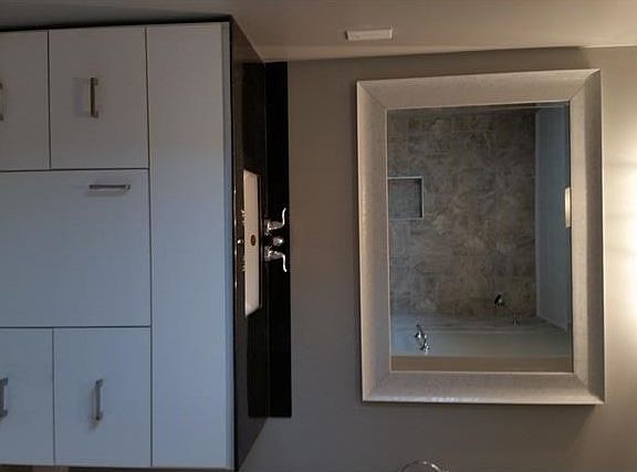 Second full bathroom. Custom marble vanity with beautiful ceramic tile shower/tub surround.