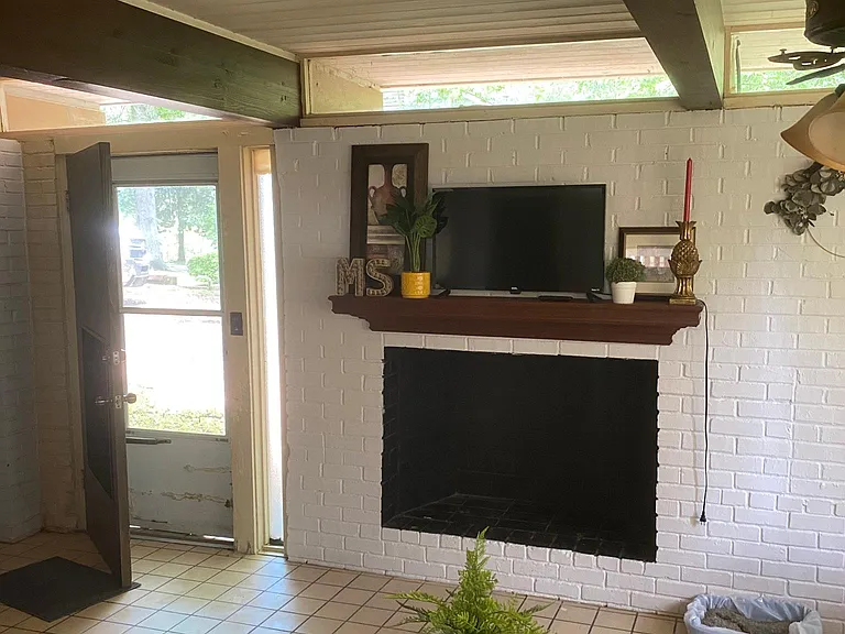 Living room with entry door.