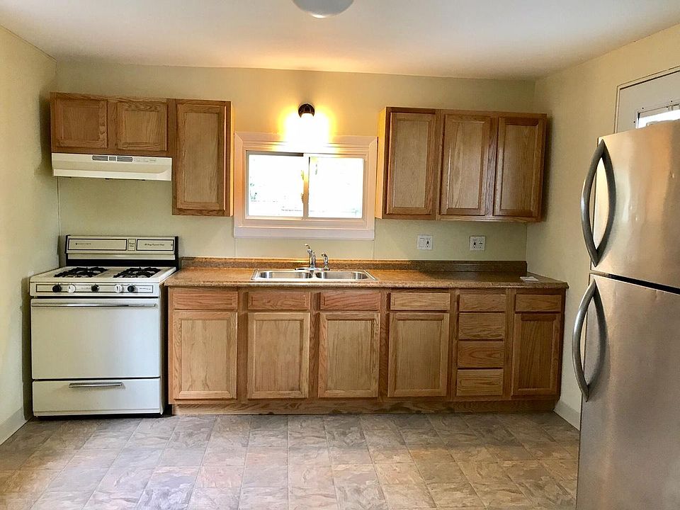 Kitchen with new floor, cupboards and counters. 