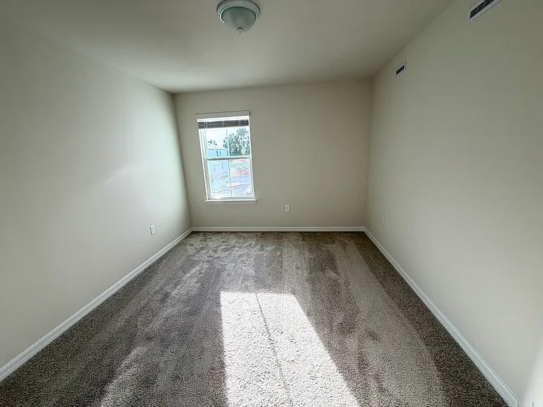 Spacious Guest Bedroom with Street-Facing Window