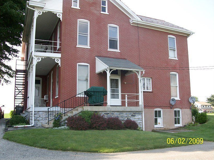 back of 3 unit farmhouse