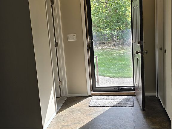 Front entrance into condo, Bathroom to the left